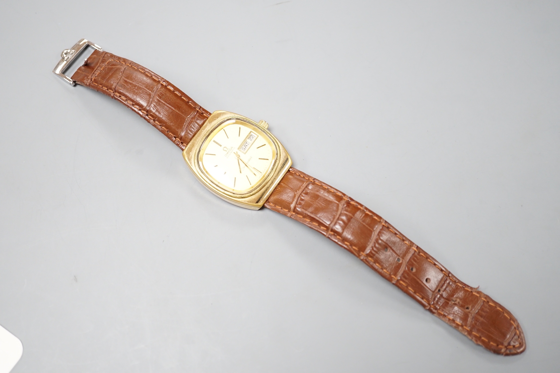 A gentleman's gold plated Omega Seamaster Automatic wrist watch, on Omega brown leather strap, with Omega buckle, case diameter 35mm, no box or papers.
